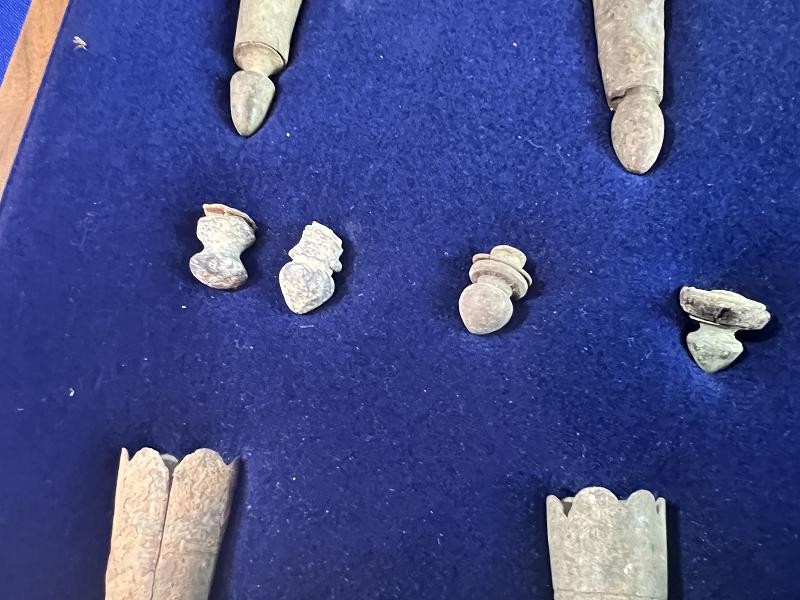CONFEDERATE COLLECTION OF DUG BAYONET SCABBARD TIPS AND LEAD CARTRIDGE BOX FINIALS